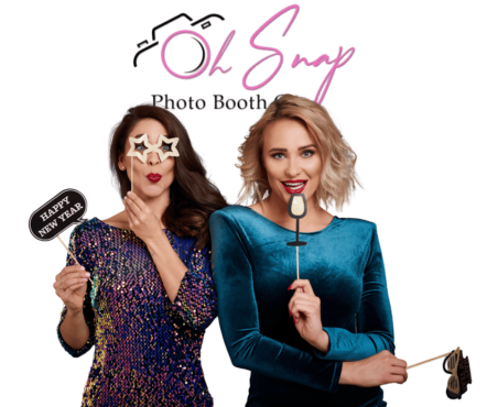 2 women holding photo booth props during a photo booth session with Oh Snap Photo Booth Co.